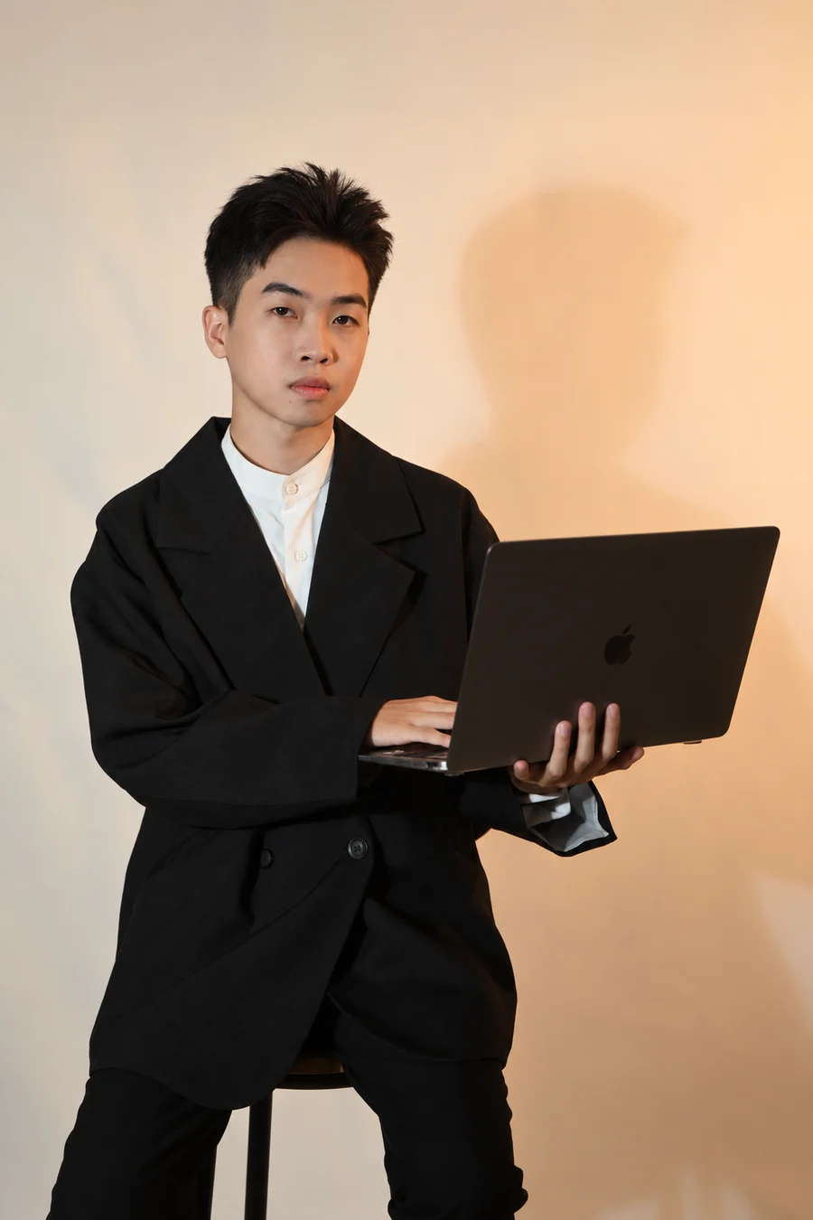 Thanh Duy Huynh holding a laptop